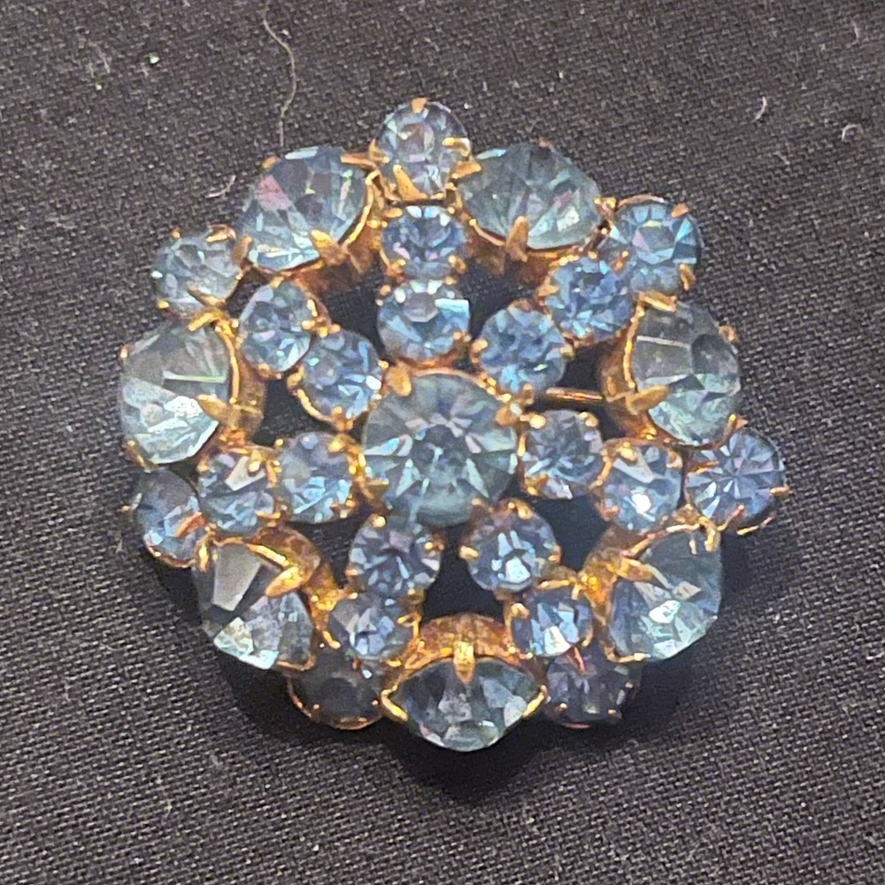Vintage Gold Tone starburst Brooch with Pale Blue Rhinestones Czechoslovakia